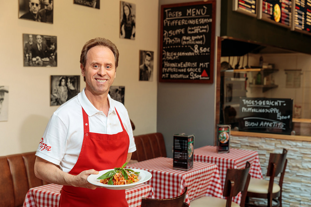 Portrait eines Inhabers einer Pizzeria