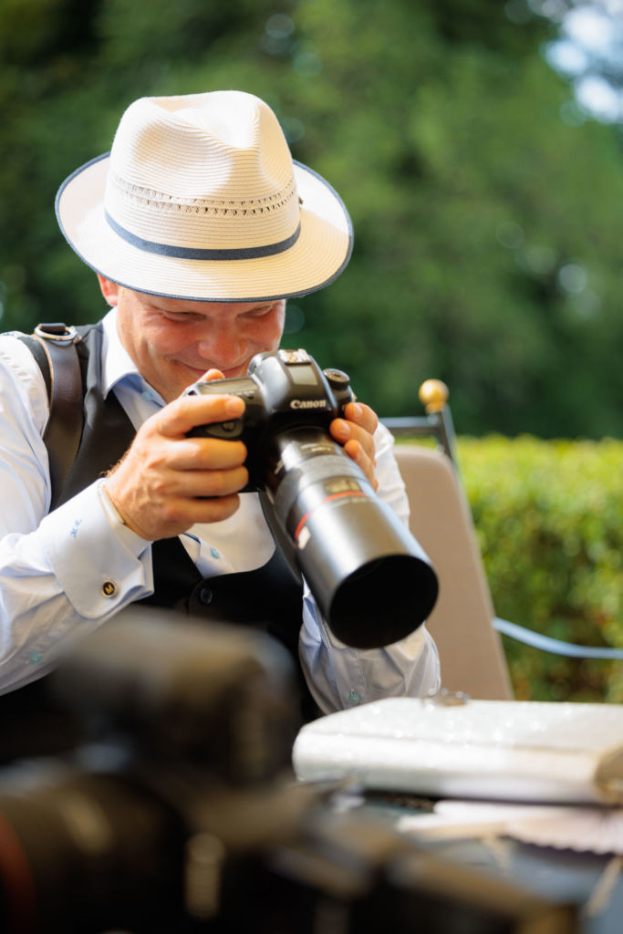 Wedding photographer taking pictures of the rings